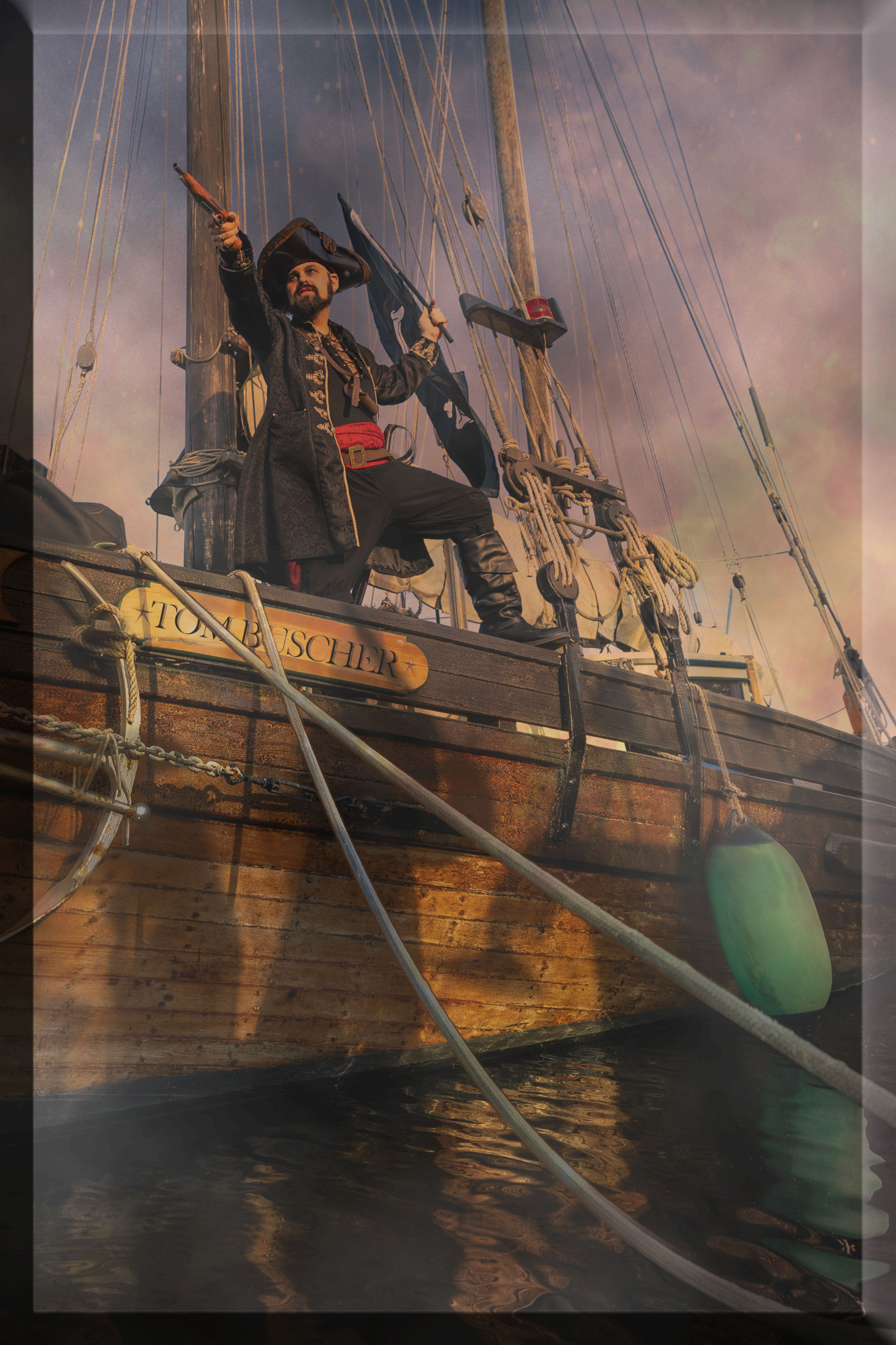 pirate sailing boat into battle with gun in one hand and flag in the other