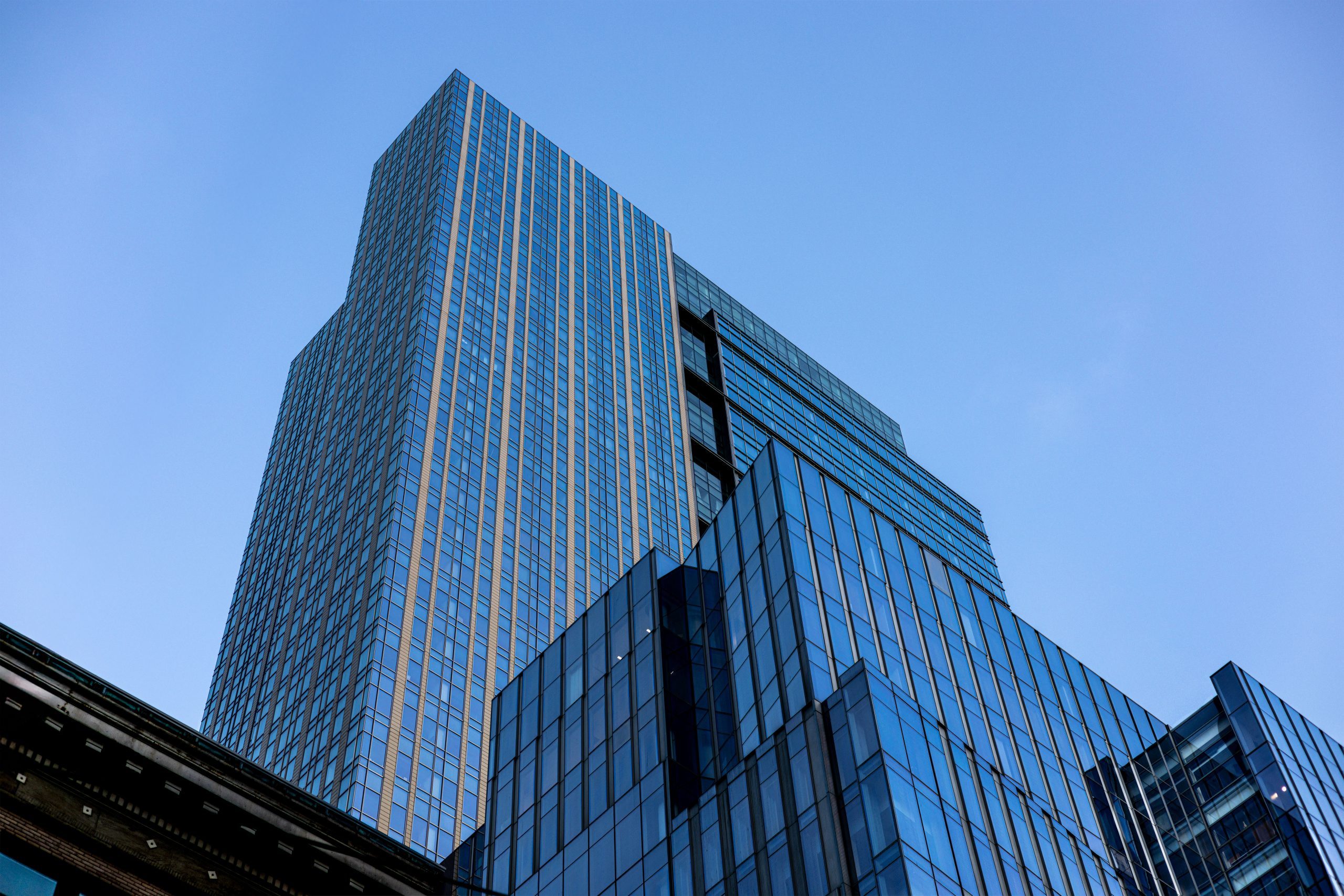 tall building in the city against a blue sky